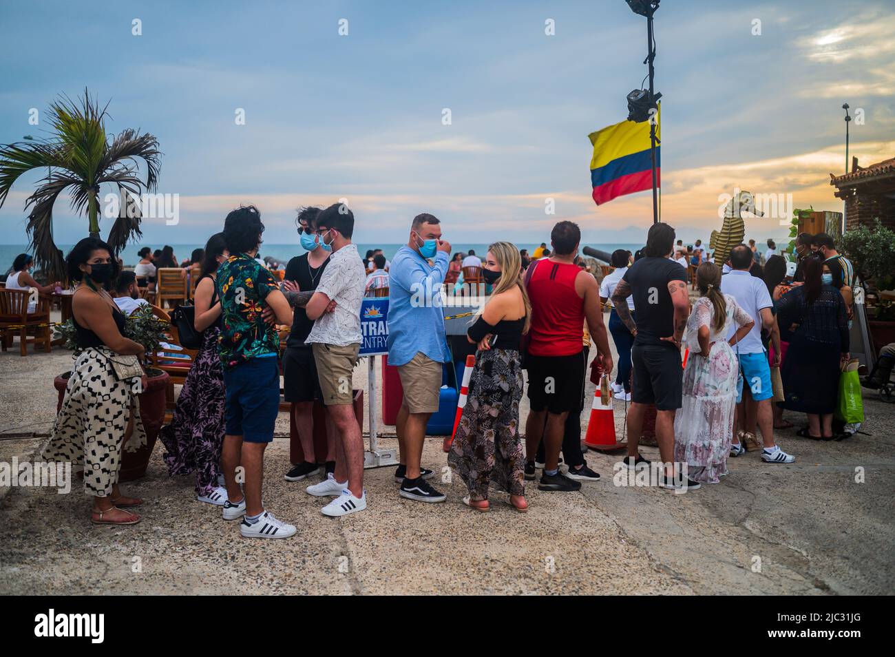 People wait in line to enter popular Cafe del Mar lounge bar atop Baluarte Santo Domingo in old walled city of Cartagena, Colombia Stock Photo