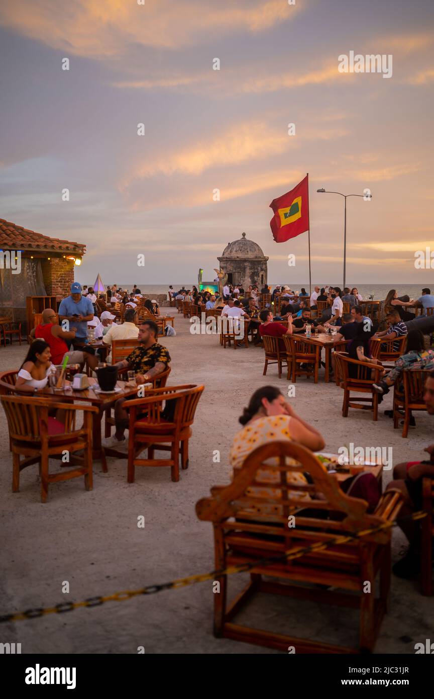 Beautiful sunset from popular Cafe del Mar lounge bar atop Baluarte Santo Domingo in old walled city of Cartagena, Colombia Stock Photo