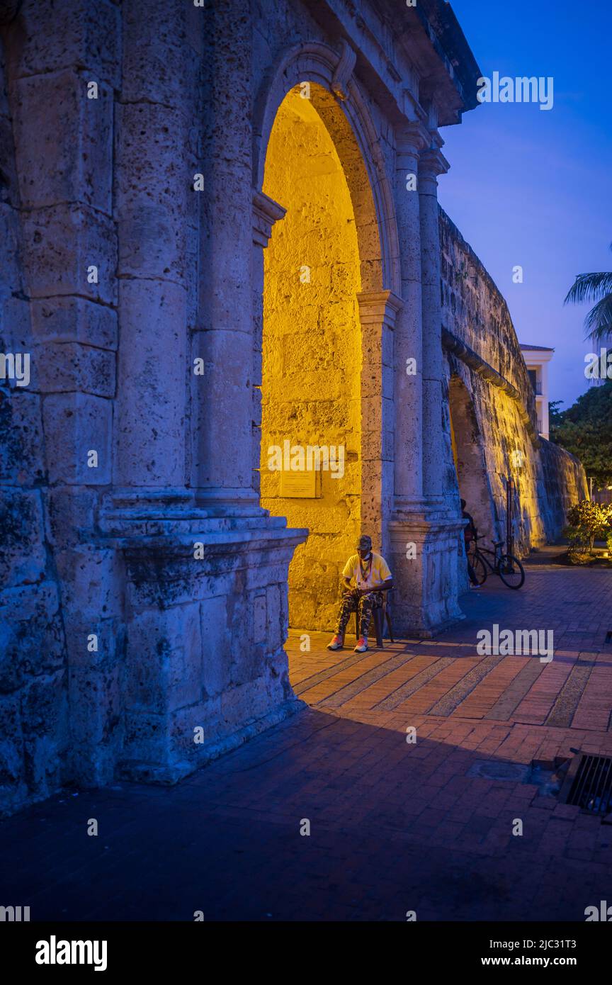 Popular Clock Tower, entrance to the walled old city of Cartagena de Indias, at night. Stock Photo