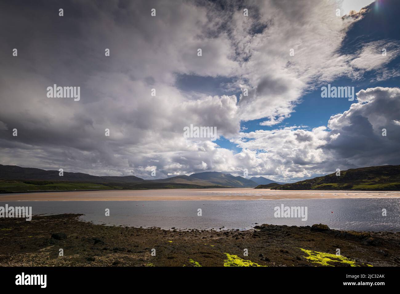 A bright summer, HDR seascape of the tidal estuary that is the Kyle of Durness in Sutherland, northern Scotland. 31 May 2022 Stock Photo