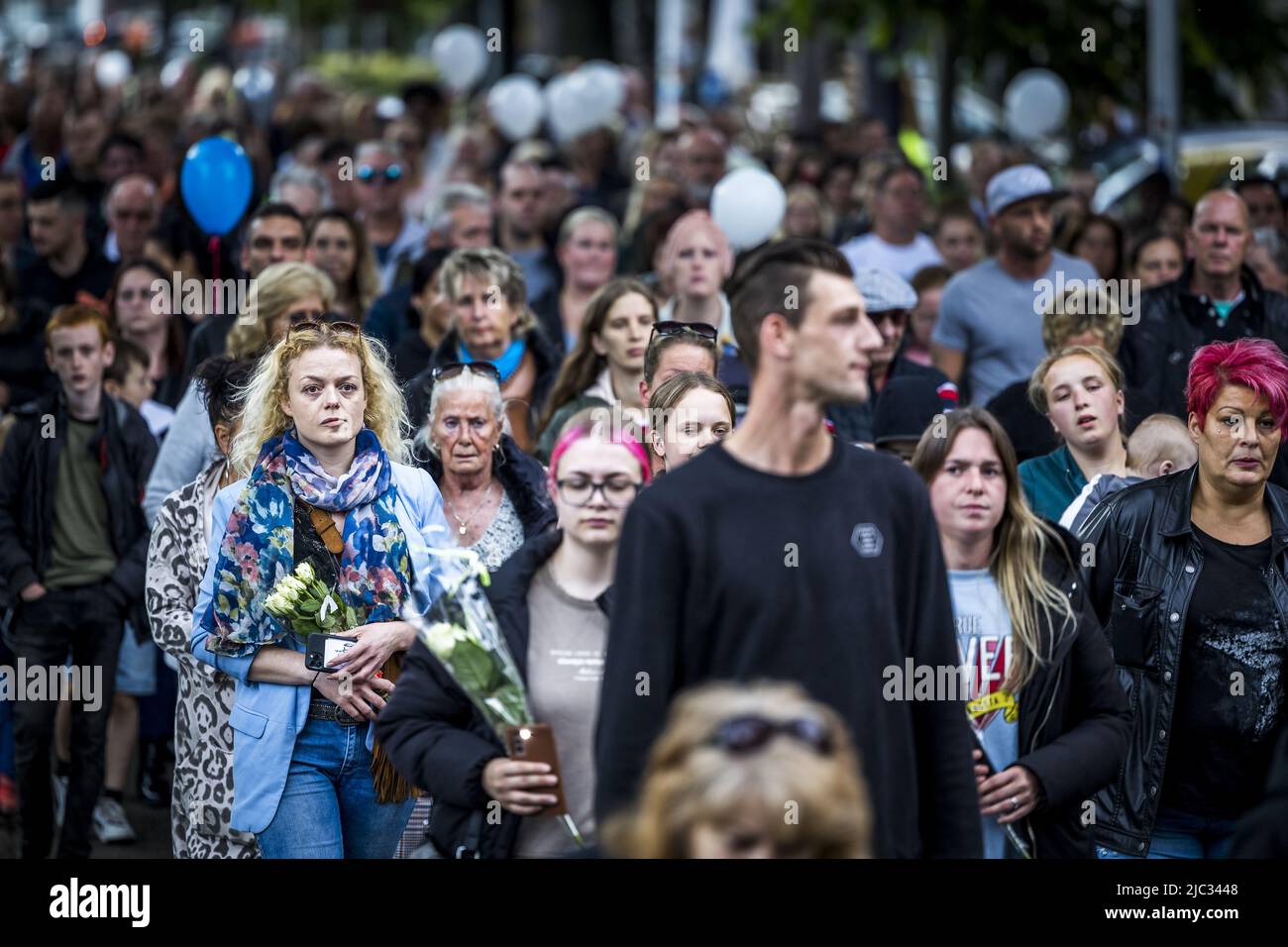 2022-06-09 18:58:02 MAASTRICHT - Participants in a silent march in memory of 9-year-old Gino in the neighborhood where he lived. The boy disappeared from a playground on June 1, and his remains were found a few days later near a house. A 22-year-old suspect has been arrested. ANP MARCEL VAN HOORN netherlands out - belgium out Stock Photo