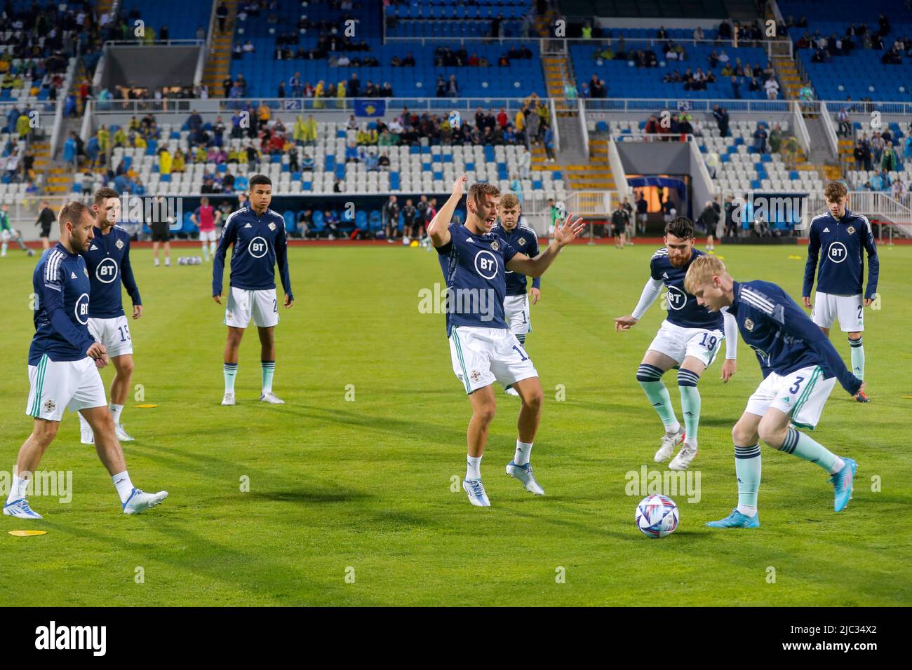 Northern Ireland players warm up on the pitch ahead of the UEFA Nations ...