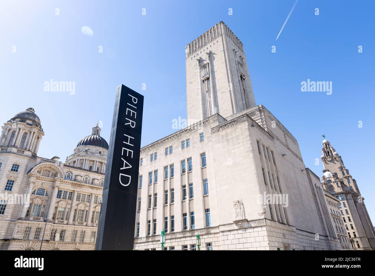 Pier Head sign in front of the art deco style George’s Dock Building, Port of Liverpool Building and Royal Liver Building, Liverpool, England, UK Stock Photo