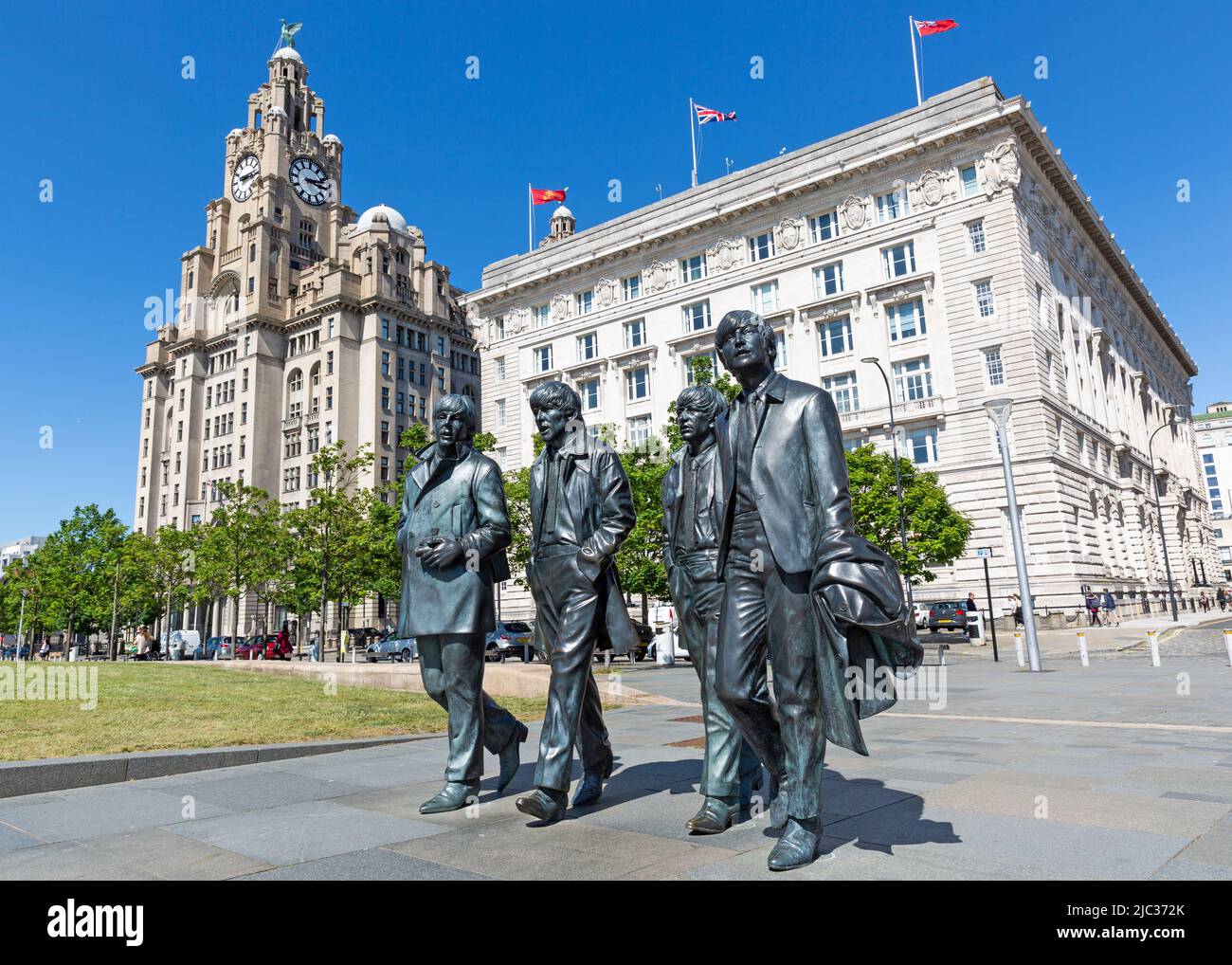 The Beatles statue, Royal Liver Building and Cunard Building, Pier Head, Liverpool, England, UK Stock Photo