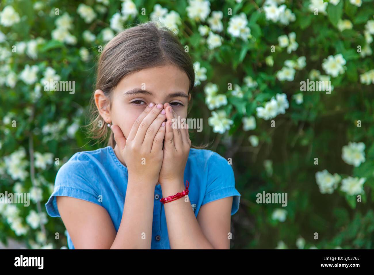 The child is allergic to flowers. Selective focus. Stock Photo