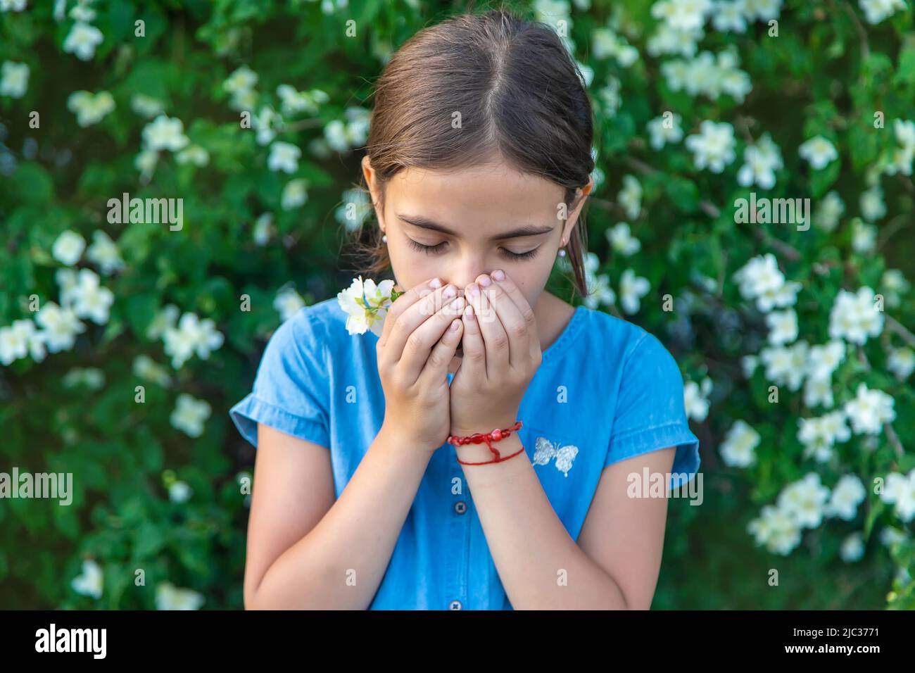 The child is allergic to flowers. Selective focus. Stock Photo