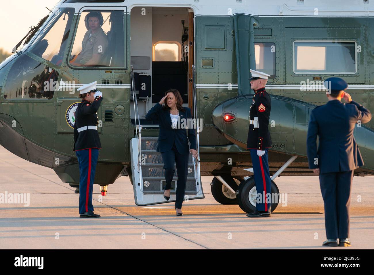 Vice President Kamala Harris salutes U.S. Marines as she disembarks Marine Two at Joint Base Andrews, Maryland, Friday, June 25, 2021, to begin her trip to El Paso, Texas. Stock Photo
