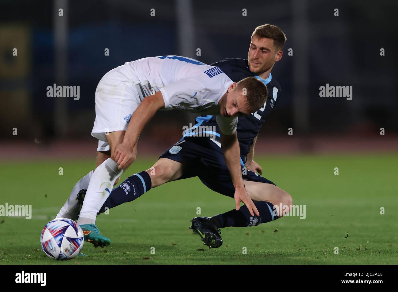 Serravalle, Italy, 9th June 2022. Marcello MularoniÊof San Marino challenges Albert Gudmundsson of Iceland during the International Friendly match at San Marino Stadium, Serravalle. Picture credit should read: Jonathan Moscrop / Sportimage Stock Photo
