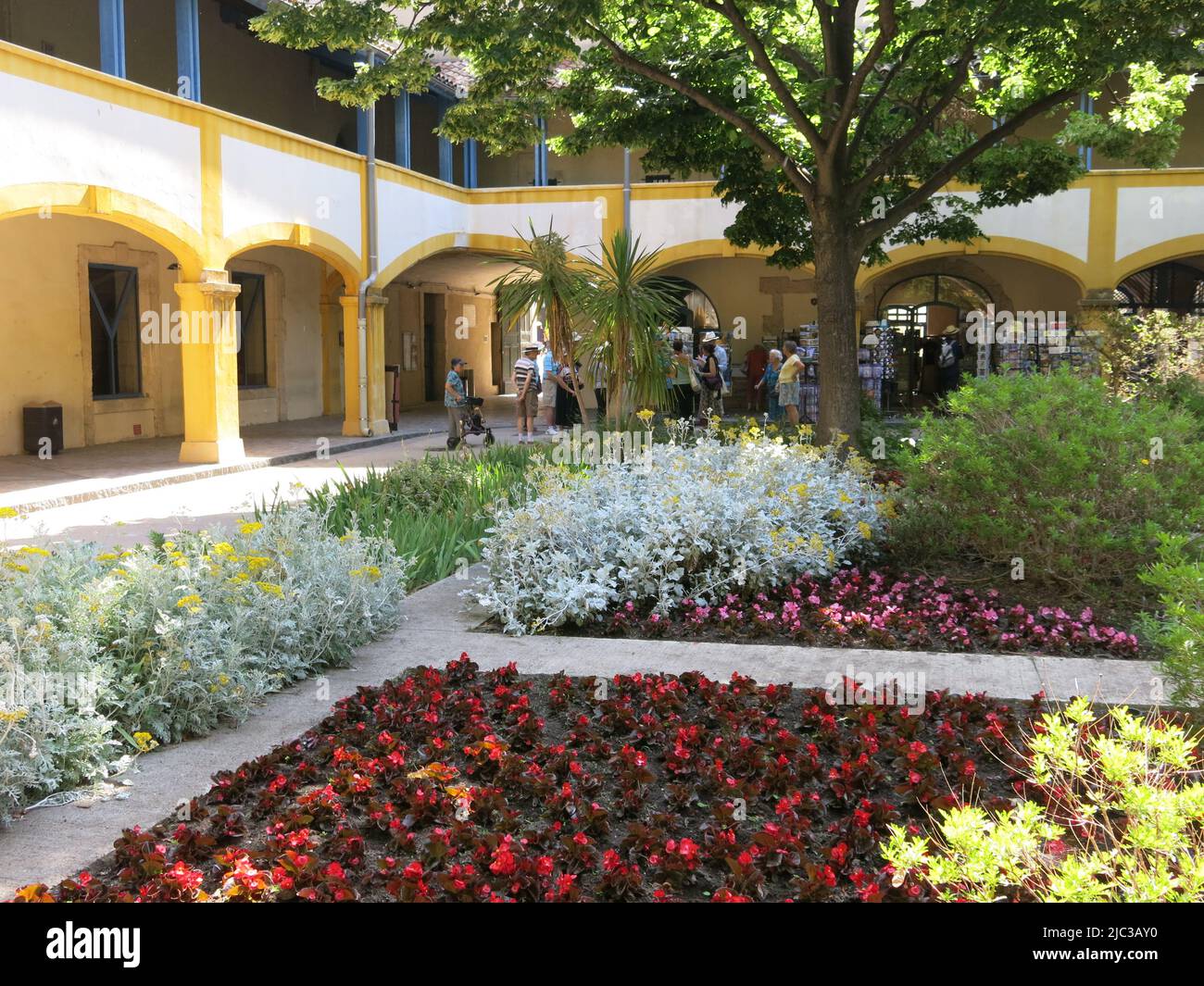 After painting the garden & distinctive yellow arches at the hospital in Arles in 1889, the colourful courtyard is preserved as the Espace Van Gogh. Stock Photo