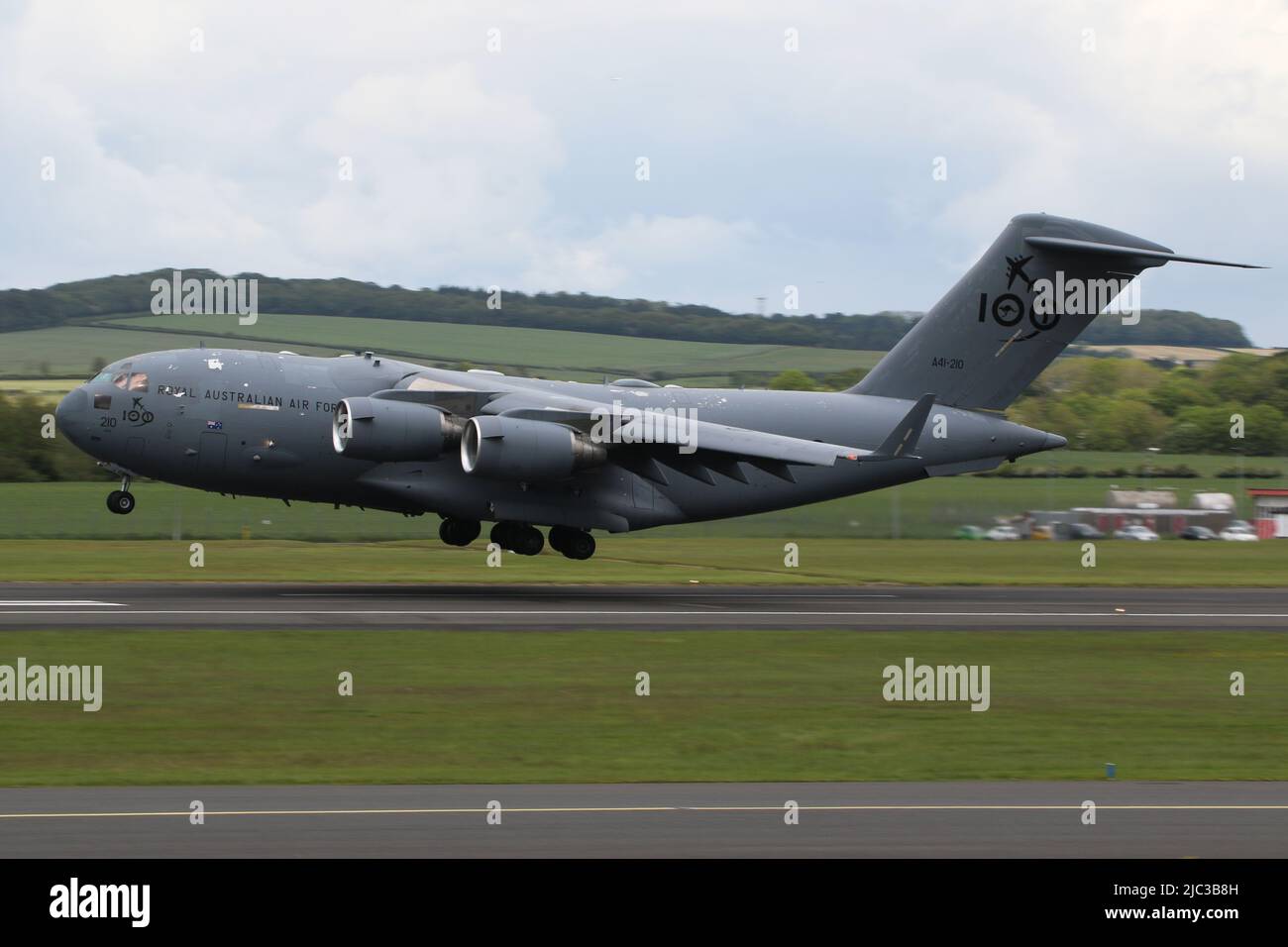 A41-210, a Boeing C-17 Globemaster III operated by the Royal Australian Air Force (RAAF), wearing markings to celebrate the force's centenial anniversary, arriving at Prestwick International Airport in Ayrshire, Scotland. Stock Photo