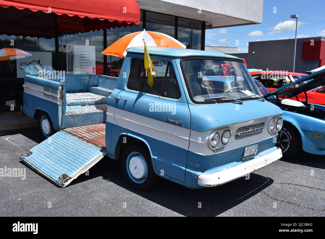 A 1960s Chevrolet Corvair 95 Rampside Pickup Truck on display at a car show. Stock Photo