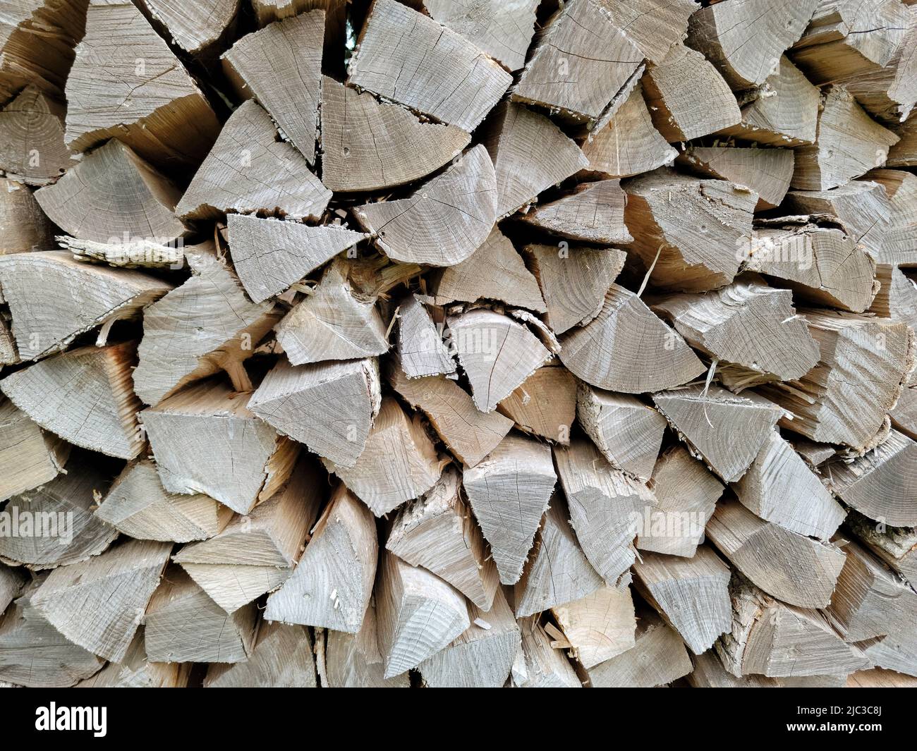 Stacked firewood for the winter season Stock Photo