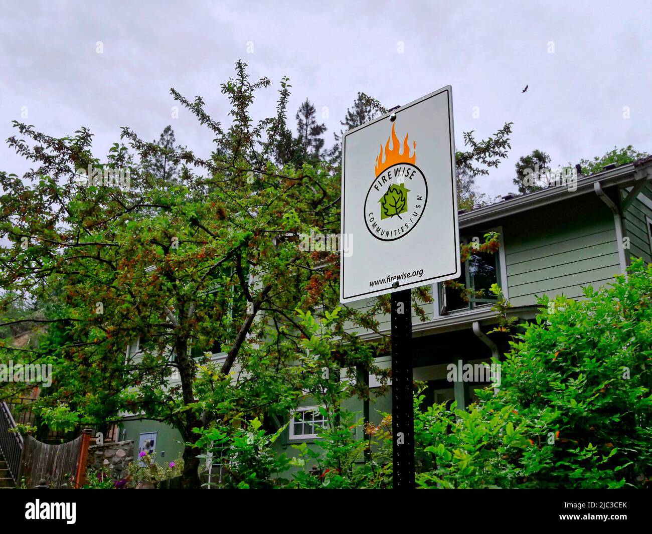 On the hillside above Ashland, Oregon, USA,a sign reads "fuel reduction