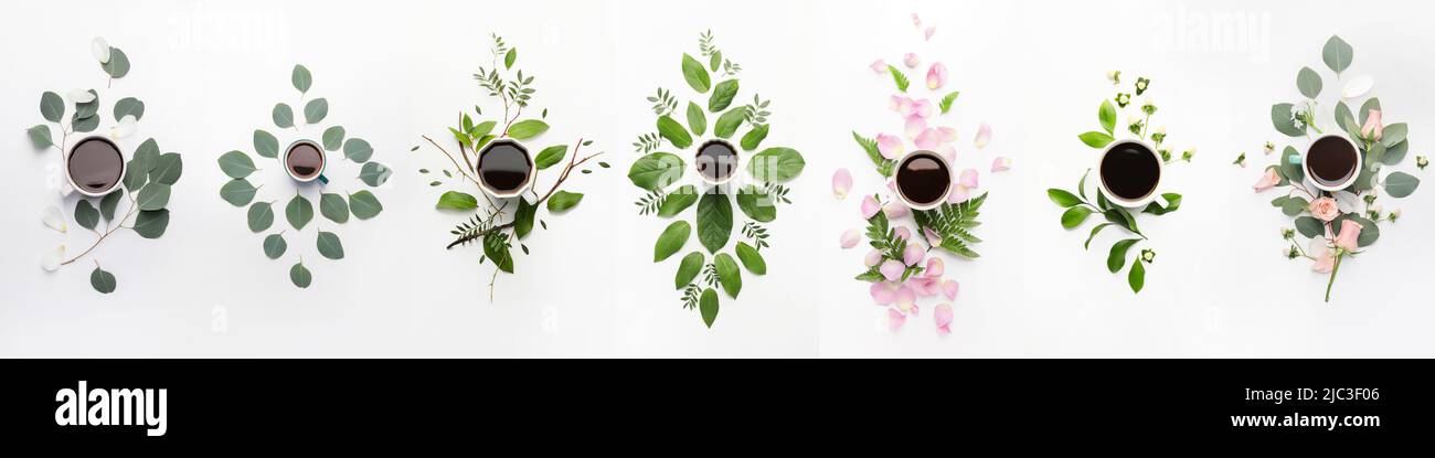 Beautiful composition with cups of coffee, leaves and flowers on white background, top view Stock Photo