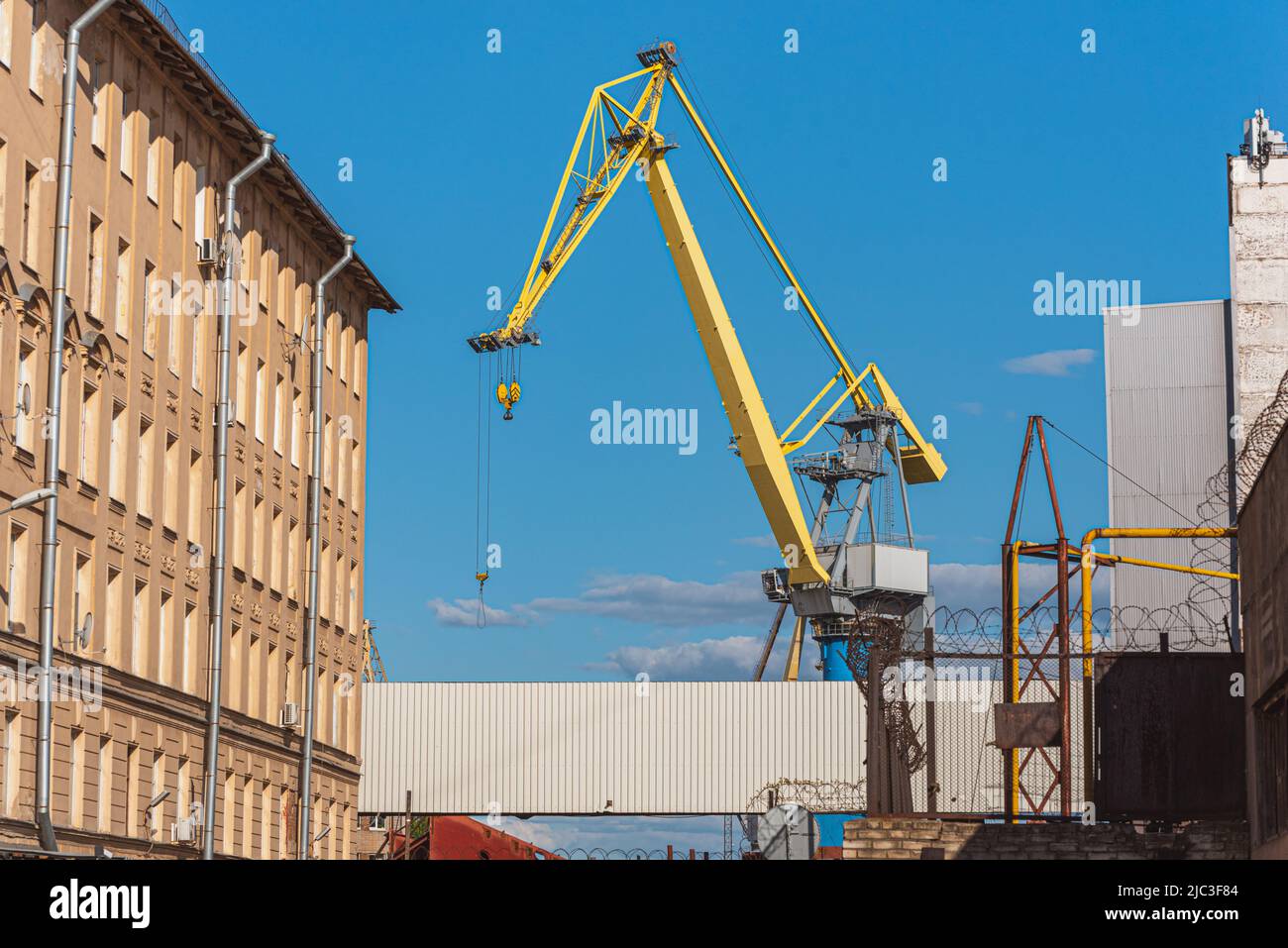 A crane in Baltic Shipyard against the blue sky - Saint Petersburg, Russia. Stock Photo