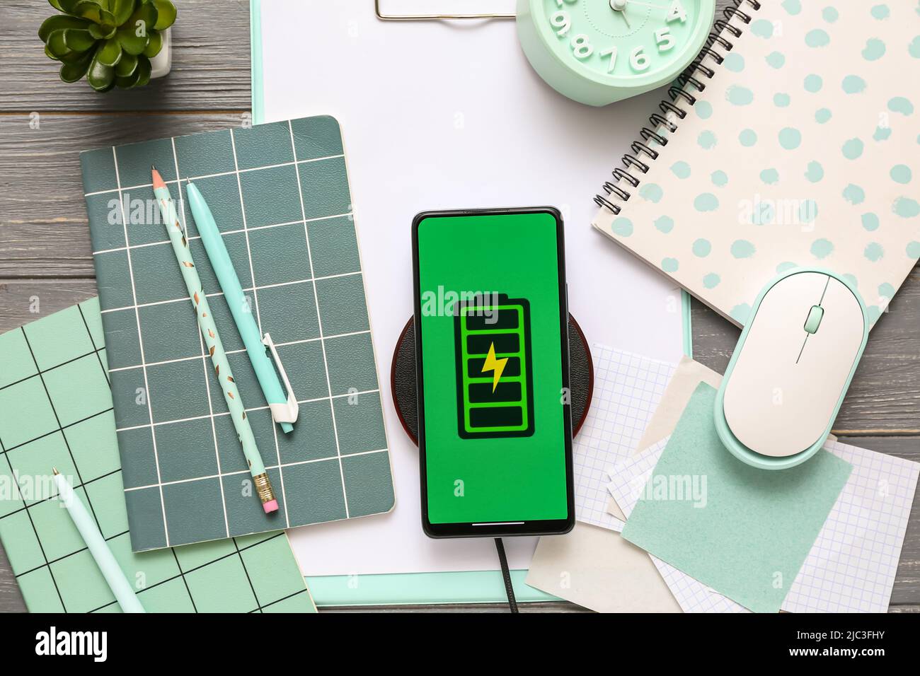 Mobile phone charging with wireless pad, computer mouse and stationery ...