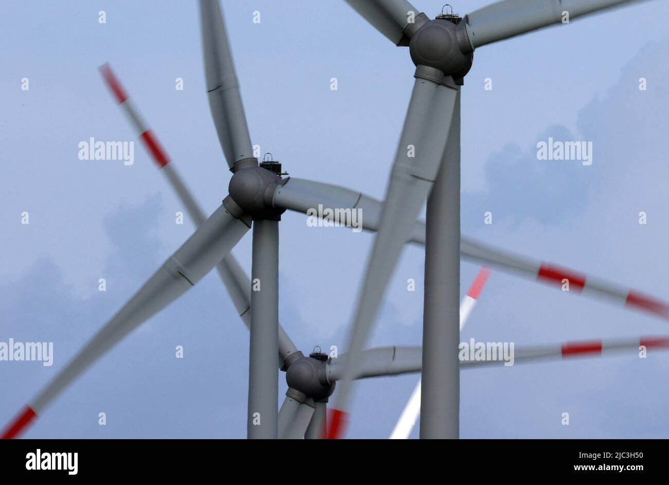 Bergtheim, Germany. 09th June, 2022. Wind turbines turn in the wind in