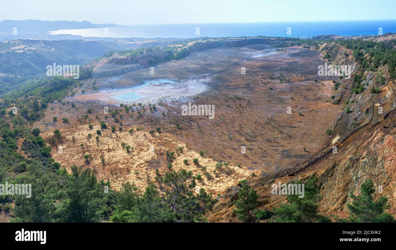 Ecosystem restoration. Aerial panorama of backfilled open pit Limni copper mine near Polis, Cyprus Stock Photo