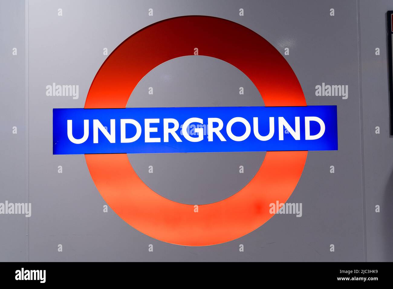 London underground roundel sign, red circle with a blue horizontal bar England UK Stock Photo