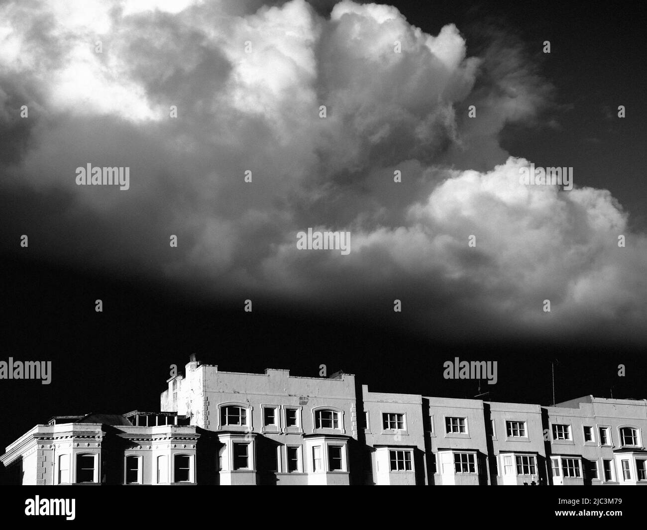 AJAXNETPHOTO. WORTHING, ENGLAND. - CUMULO STRATUS CLOUDS. - FORMING OVER APARTMENTS OVERLOOKING THE SEA-FRONT.  PHOTO:JONATHAN EASTLAND REF;P78 132810 147 Stock Photo