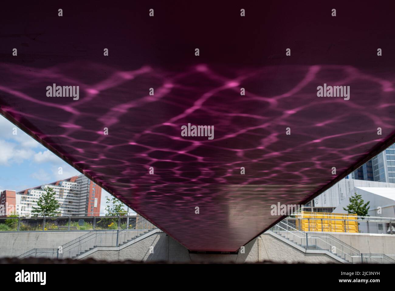 Rippling Reflections underneath a bridge at Olympia Park, London Stock Photo