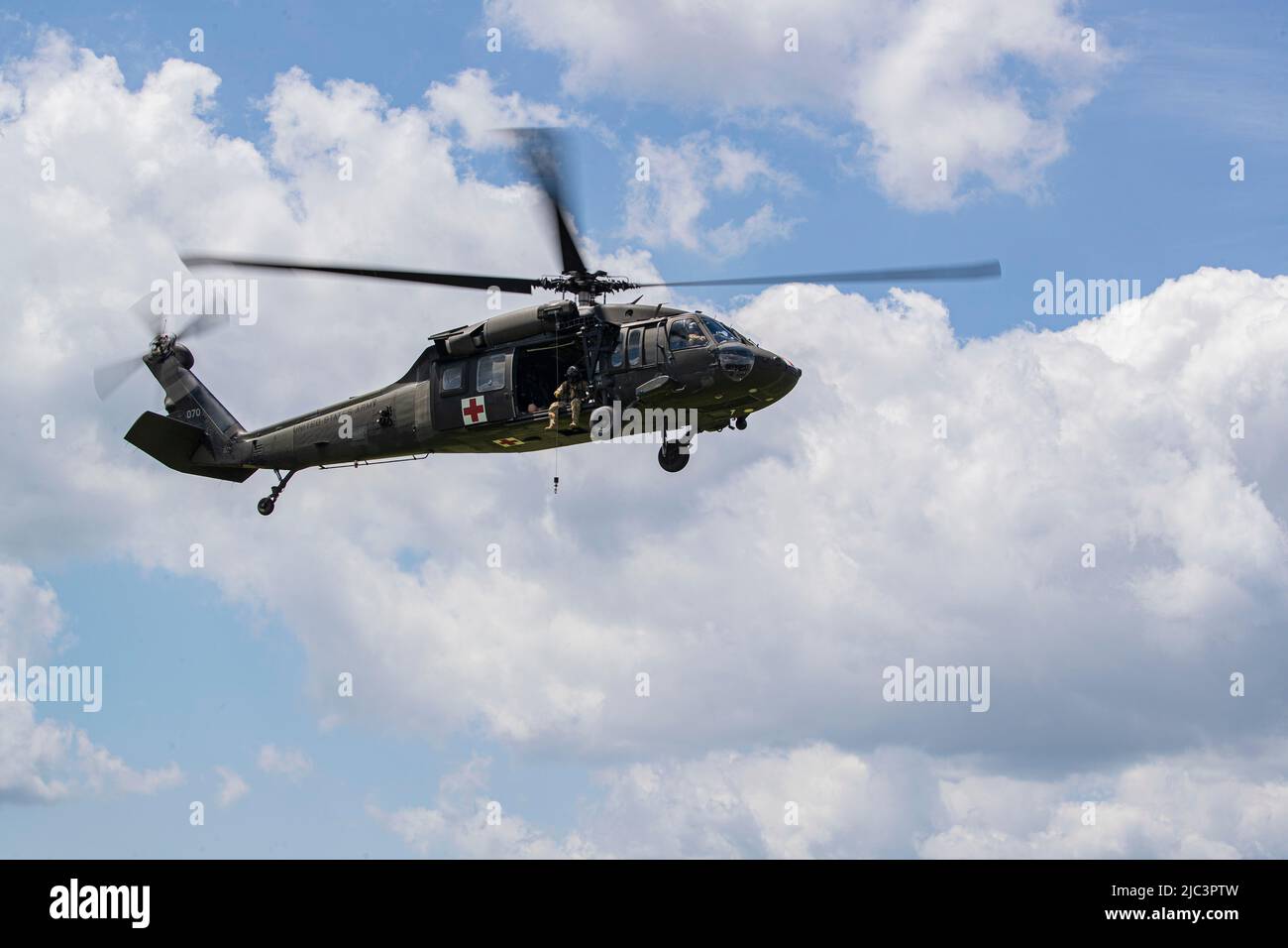 A New Jersey National Guard UH-60L Black Hawk helicopter with Detachment 1, C Company, 1-171st MEDEVAC flies during a Medical Simulation Training Center class on Joint Base McGuire-Dix-Lakehurst, New Jersey, June 9, 2022. The Medical Simulation Training Center provides state of the art training to aid students in gaining proficiency in treating all areas of trauma and basic medical scenarios. (U.S. Air National Guard photo by Master Sgt. Matt Hecht) Stock Photo