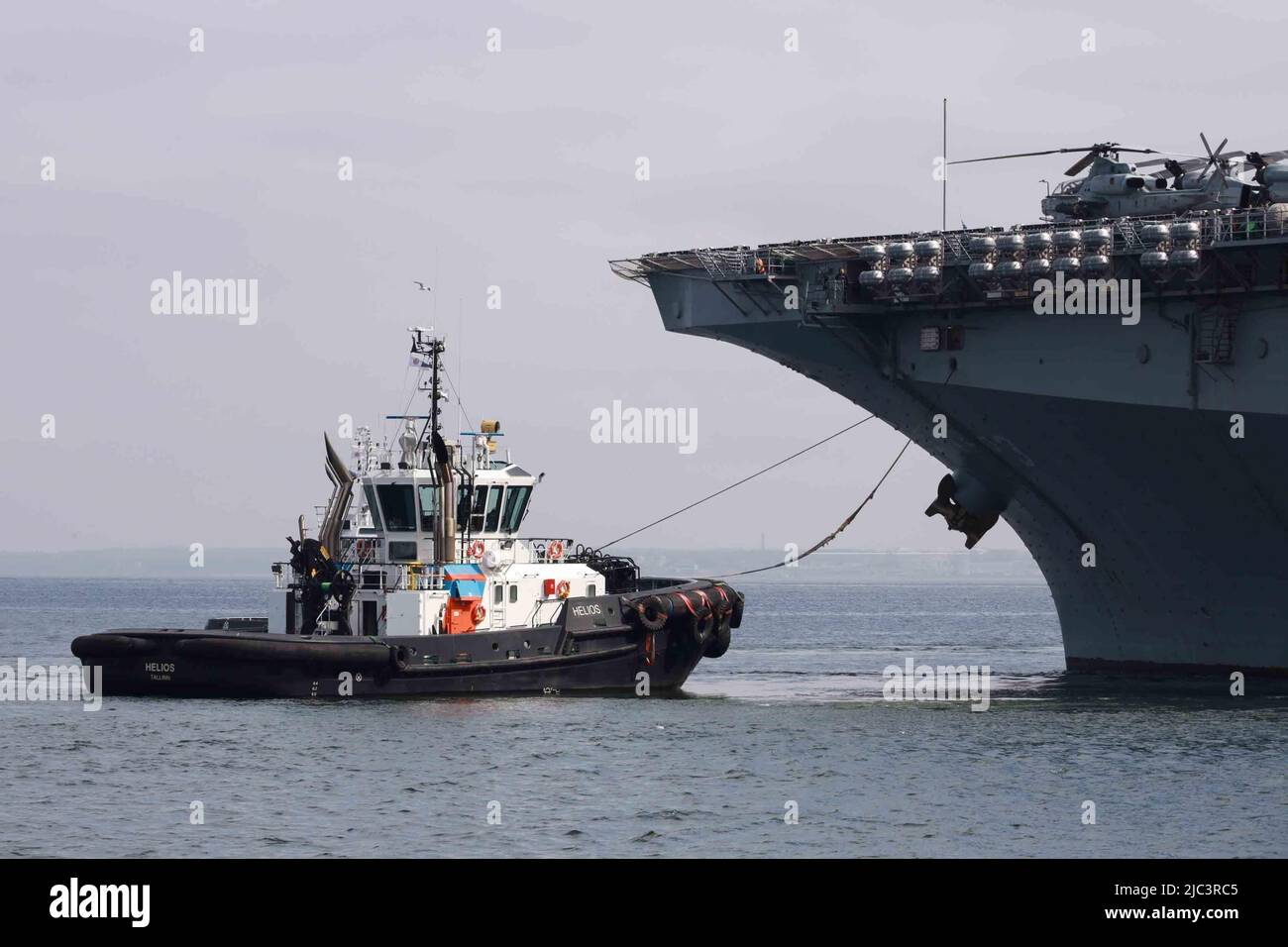 The Wasp-class amphibious assault ship USS Kearsarge (LHD 3) being towed into port in Tallinn, Estonia for a port visit after exercise Siil (Hedgehog) 22, May 27, 2022. The Kearsarge Amphibious Ready Group and embarked 22nd Marine Expeditionary Unit, under the command and control of Task Force 61/2, are on a scheduled deployment in the U.S. Naval Forces Europe area of operations, employed by U.S. Sixth Fleet to defend U.S., Allied and Partner interests. (U.S. Marine Corps photo by Chief Warrant Officer 4 Izzel Sanchez) Stock Photo