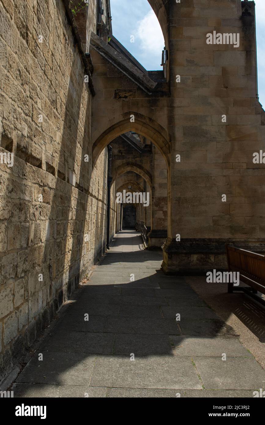Archways outside Winchester Cathedral Stock Photo