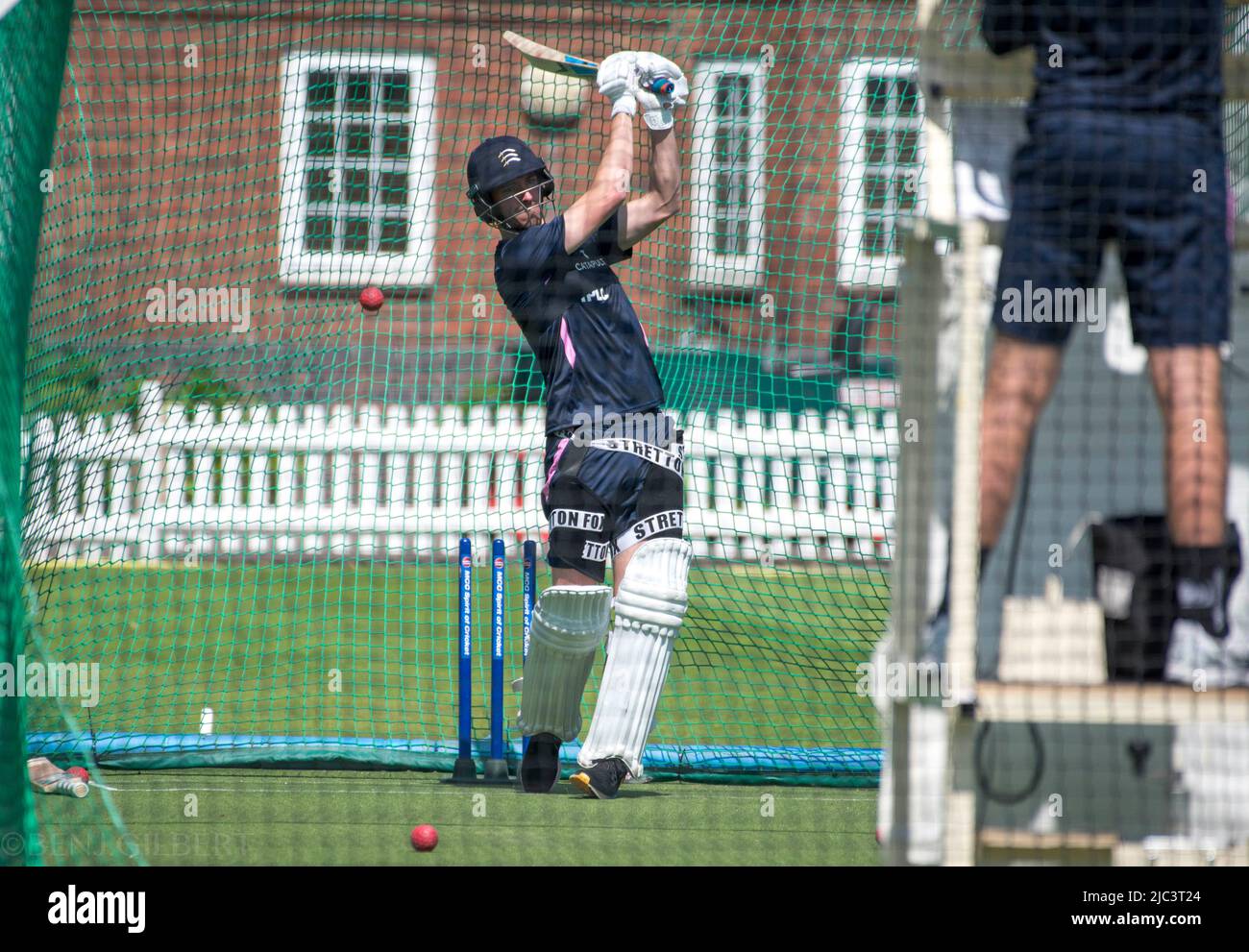 Toby Roland-Jones smashes the ball in the nets during a Middlesex Training session on the 17th of May 2022 Stock Photo