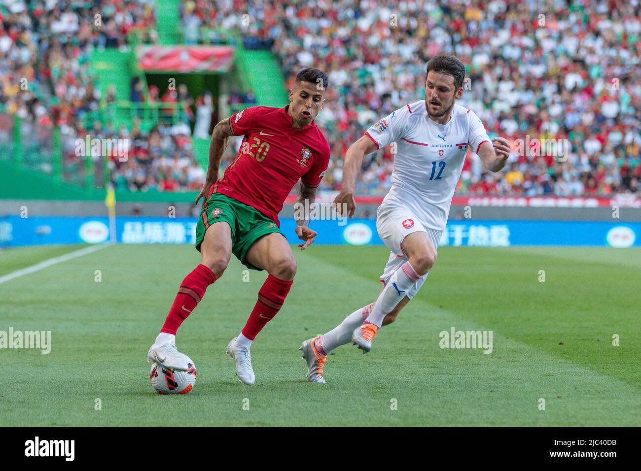June 09, 2022. Lisbon, Portugal. Portugal's and Manchester City defender Joao Cancelo (20) and Czechia's and Plzen defender Milan Havel (12) in action during the UEFA Nations League Final Tournament between Portugal and Czechia Credit: Alexandre de Sousa/Alamy Live News Stock Photo