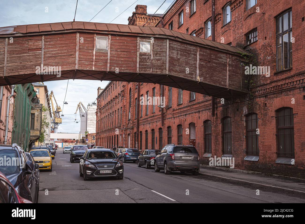 St. Petersburg, Russia - May 31, 2022: a wooden factory bridge over Kozhevennaya Line. Old Brusnitsyn tannery in Vasilyevsky Island. Stock Photo