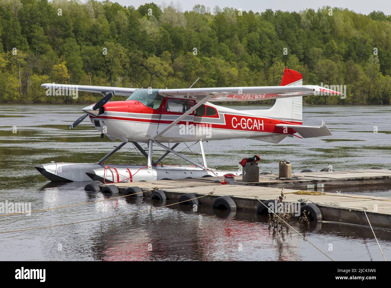 A Cessna 180J Skywagon seaplane taking off from Saint Maurice river for a scenic flight over Quebec. Owned by HYDRAVION AVENTURE specialized in scenic flights over typical QuÈbec countryside Stock Photo