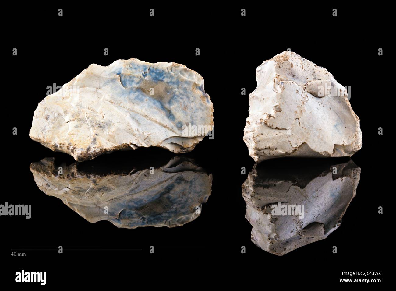 Stone tools on black background. Stock Photo