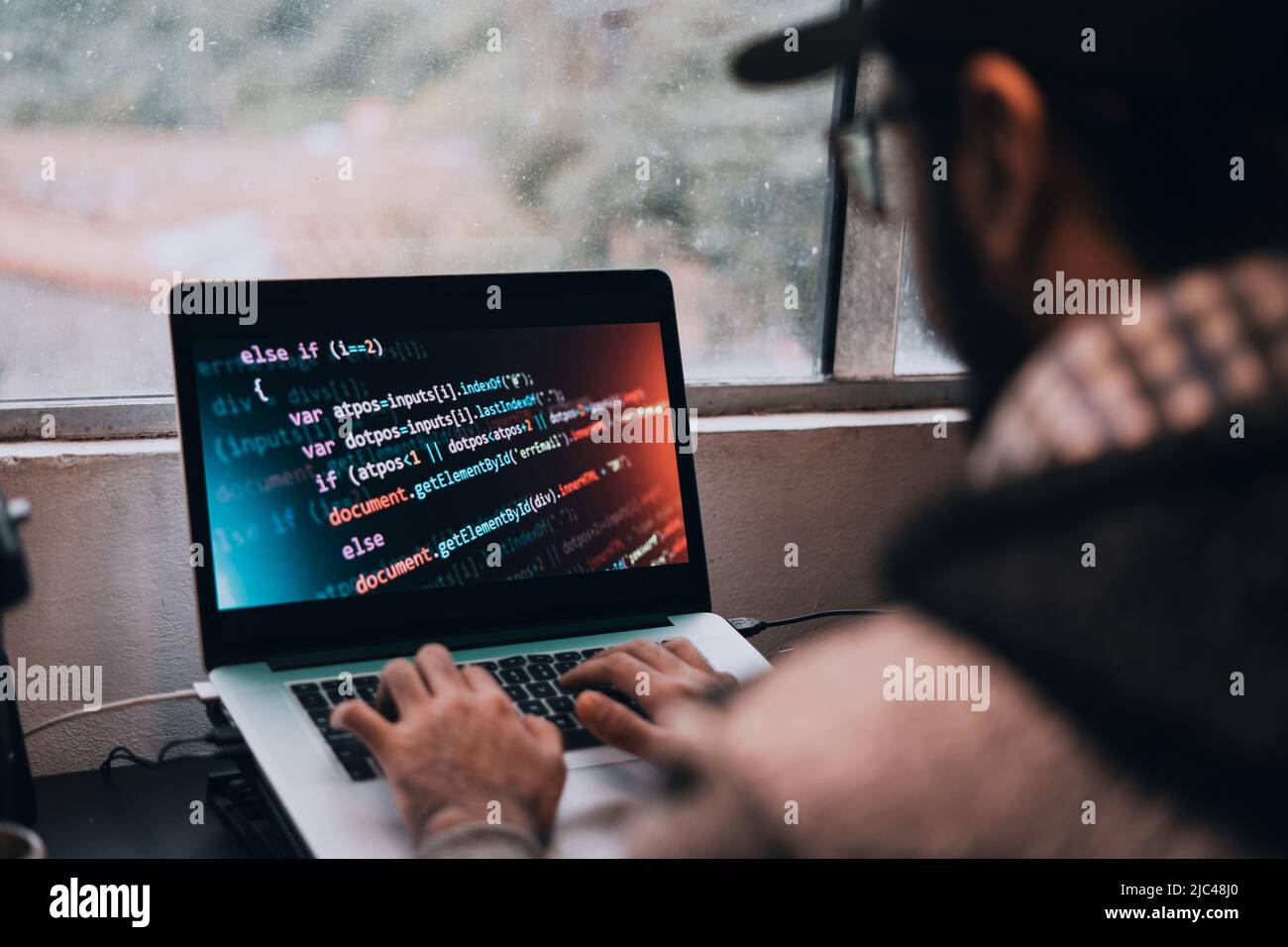 Young man studying from his computer at home Stock Photo