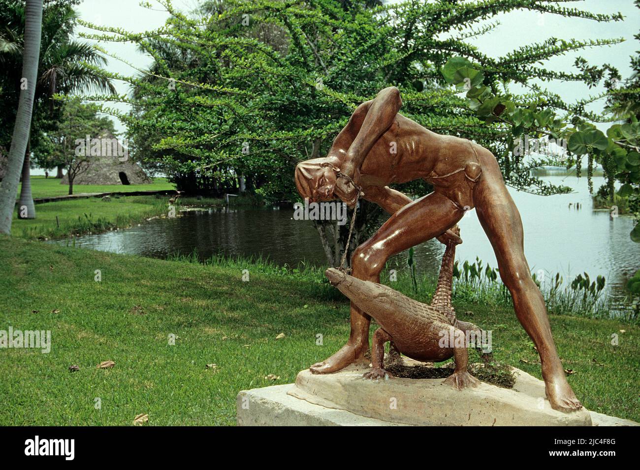 Sculpture at Indian village shows Abey the Crocodile hunter, National park Montemar, Guama, Cuba, Caribbean Stock Photo