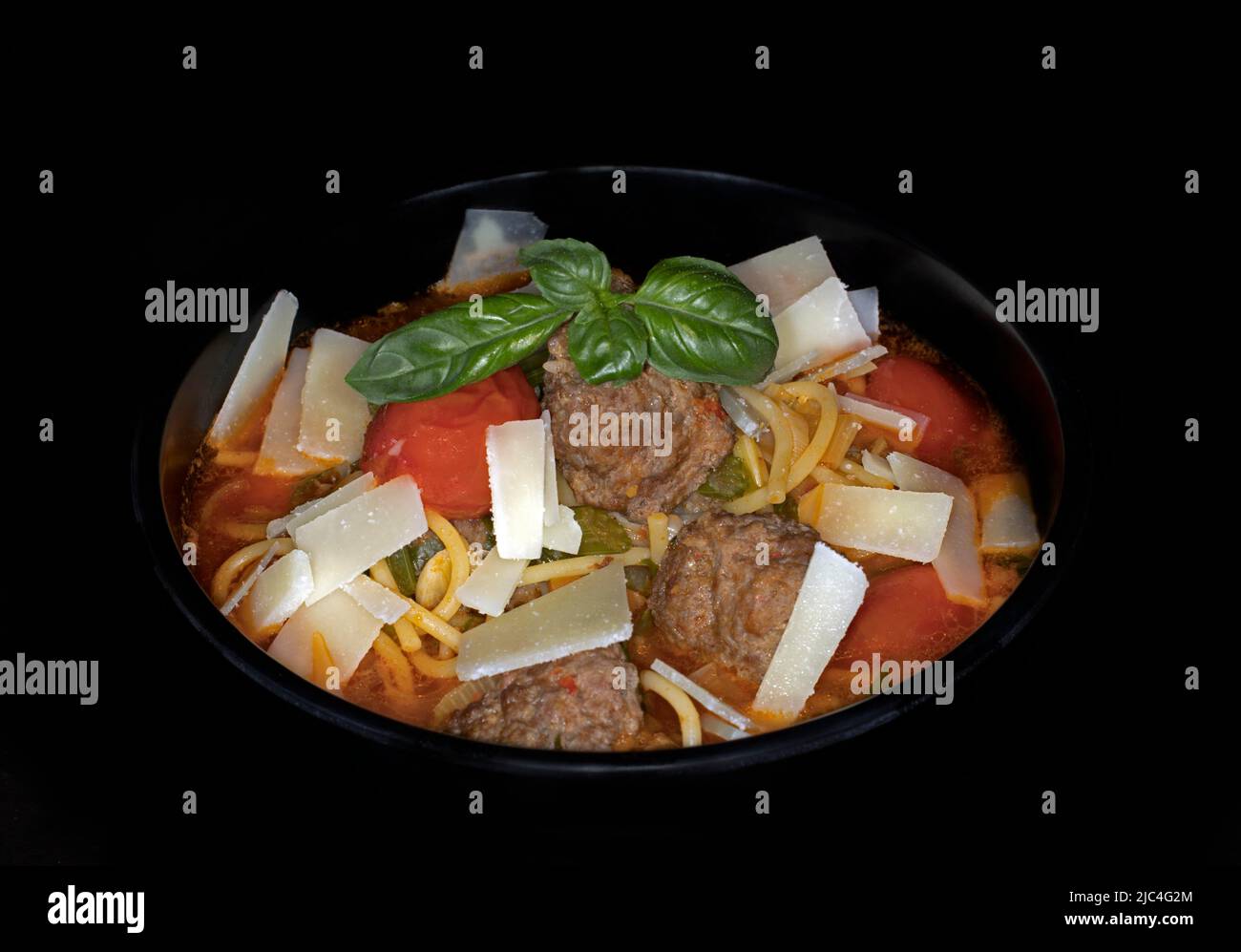 Italian vegetable soup minestrone, with veal meatballs, tomatoes