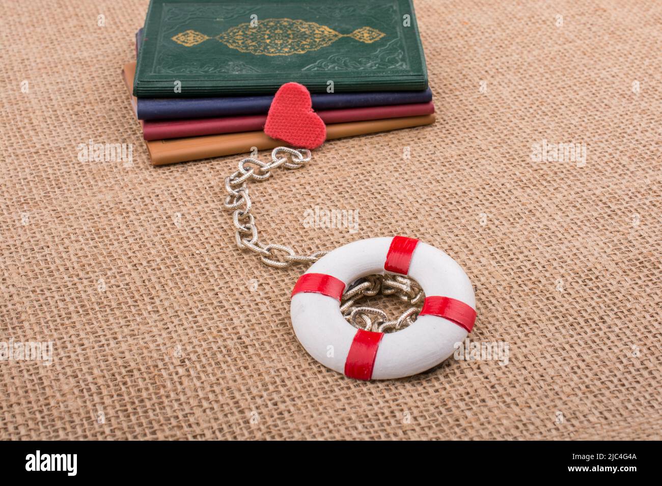 Little books attached to a life saver with a chain Stock Photo