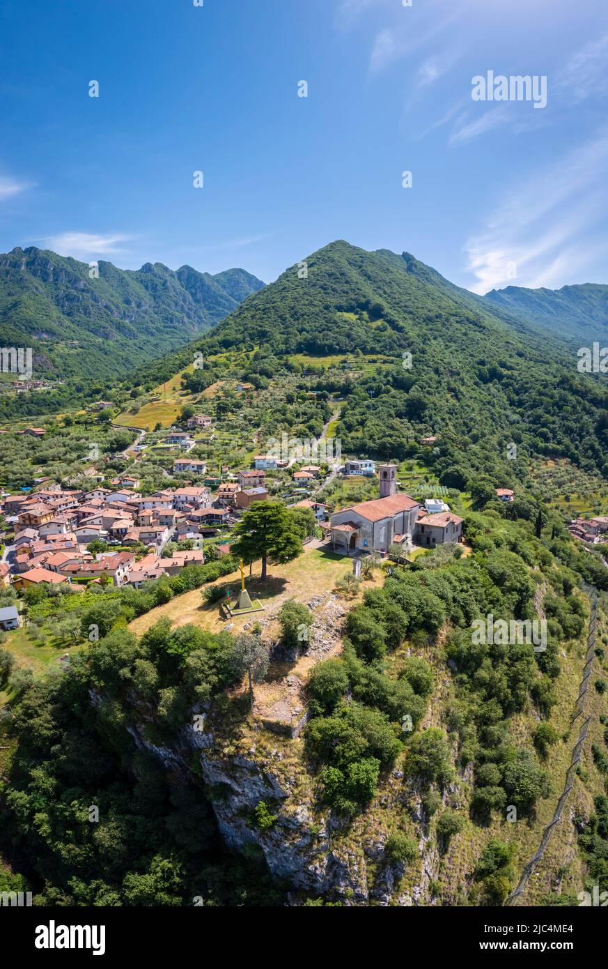 Aerial view of the Eremo di San Pietro church on a hill dominating Iseo lake, in front of Montisola. Marone, Brescia province, Lombardy, Italy, Europe. Stock Photo