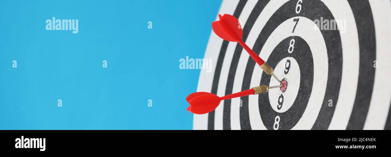 Dart arrow hitting center target hi-res stock photography and images ...
