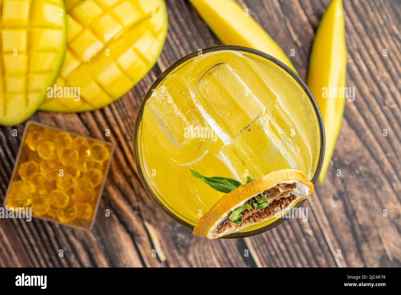 Mango lemonade with bubble tea on dark wooden background Stock Photo