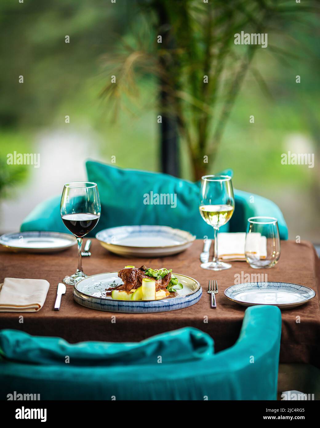Served restaurant table with drinks and food Stock Photo