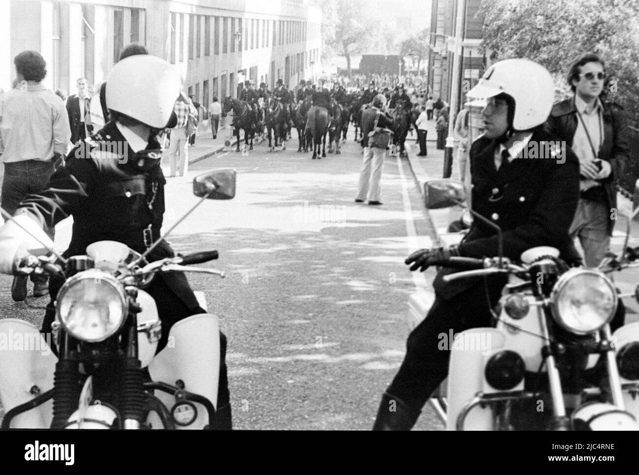 A far right National Front March, London, England, United Kingdom, surrounded by police officers, September, 1978. On the same day an Anti Nazi League march took place in London so the police were there in great numbers to keep the two marches apart and deal with any conflict between them. Stock Photo