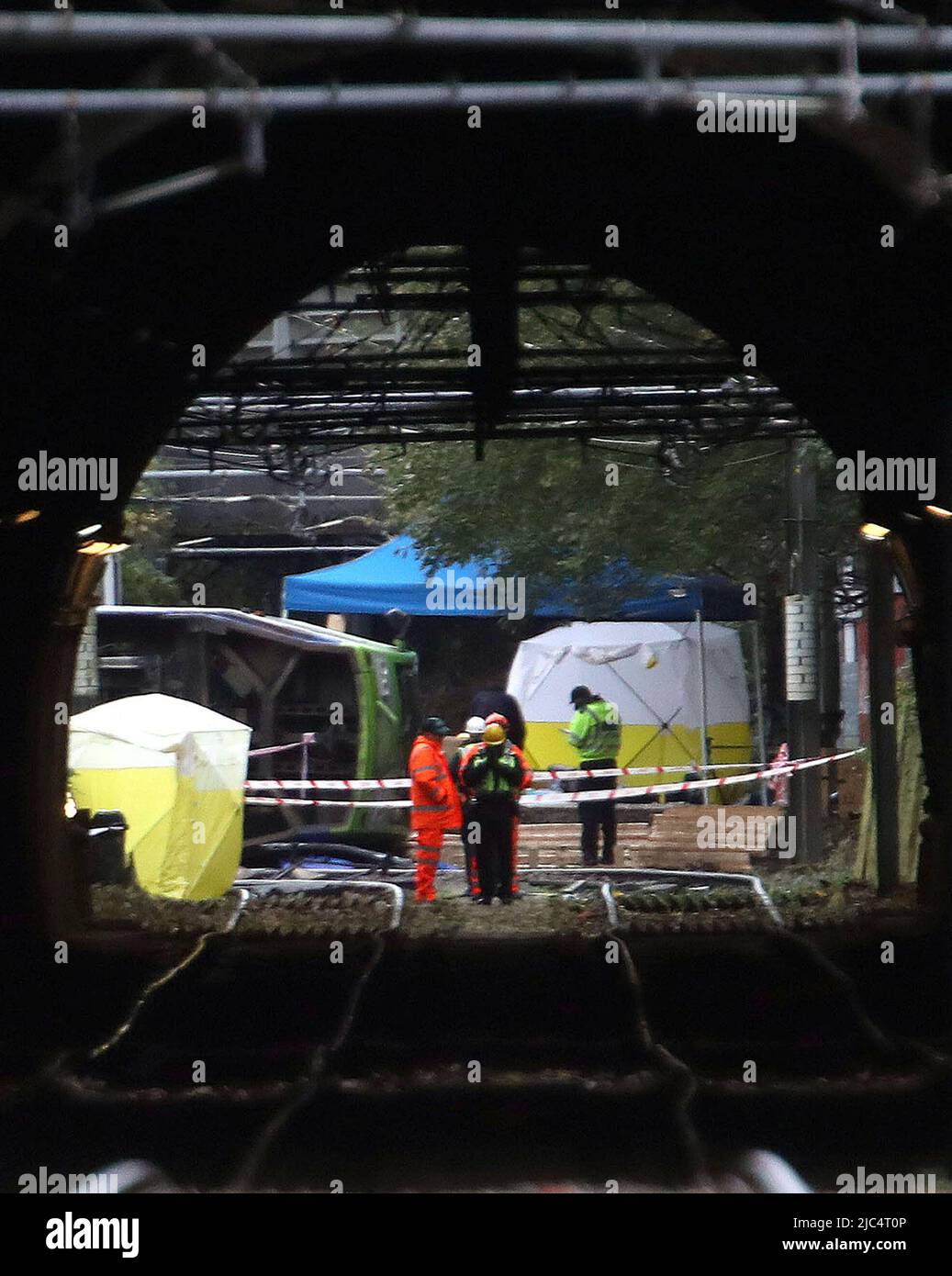 File photo dated 10/11/16 of investigators at the scene after a tram derailed and overturned in Croydon, south London, killing at least seven people. The first court hearing for a criminal prosecution relating to the Croydon tram crash will take place on Friday. Issue date: Friday June 10, 2022. Stock Photo