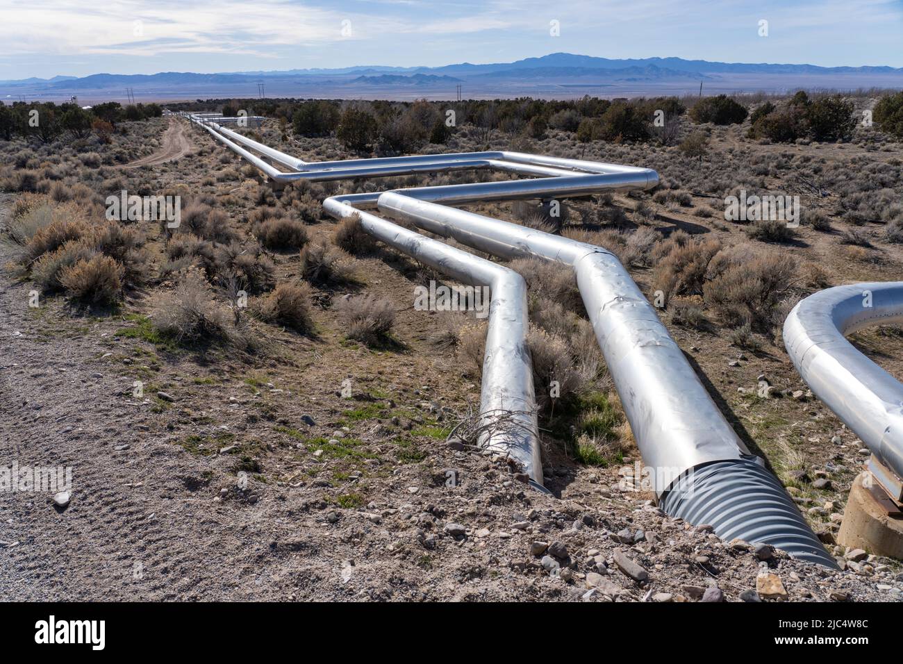 Steam and hot water pipelines with heat expansion loops feeding the
