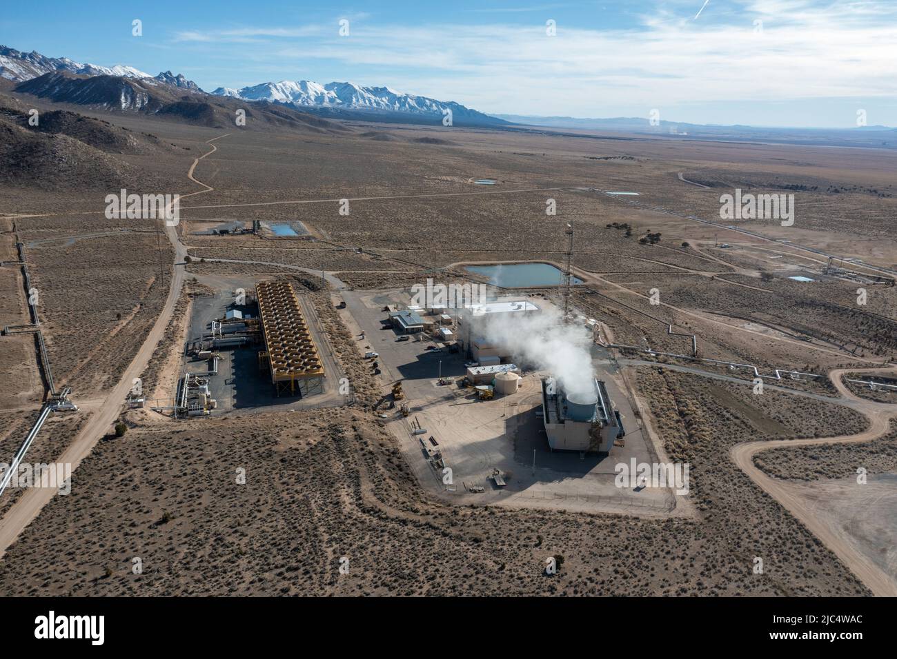 Steam rising from cooling towers at the Blundell Geothermal Power Plant