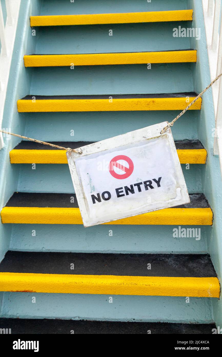 No entry sign across steep black and yellow stairs on a calmac ferry to