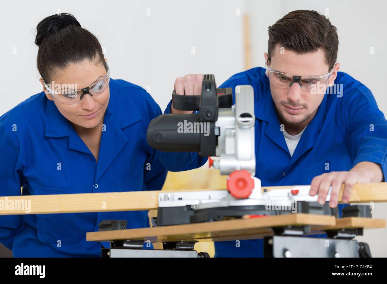 student in carpentry class using circular saw Stock Photo