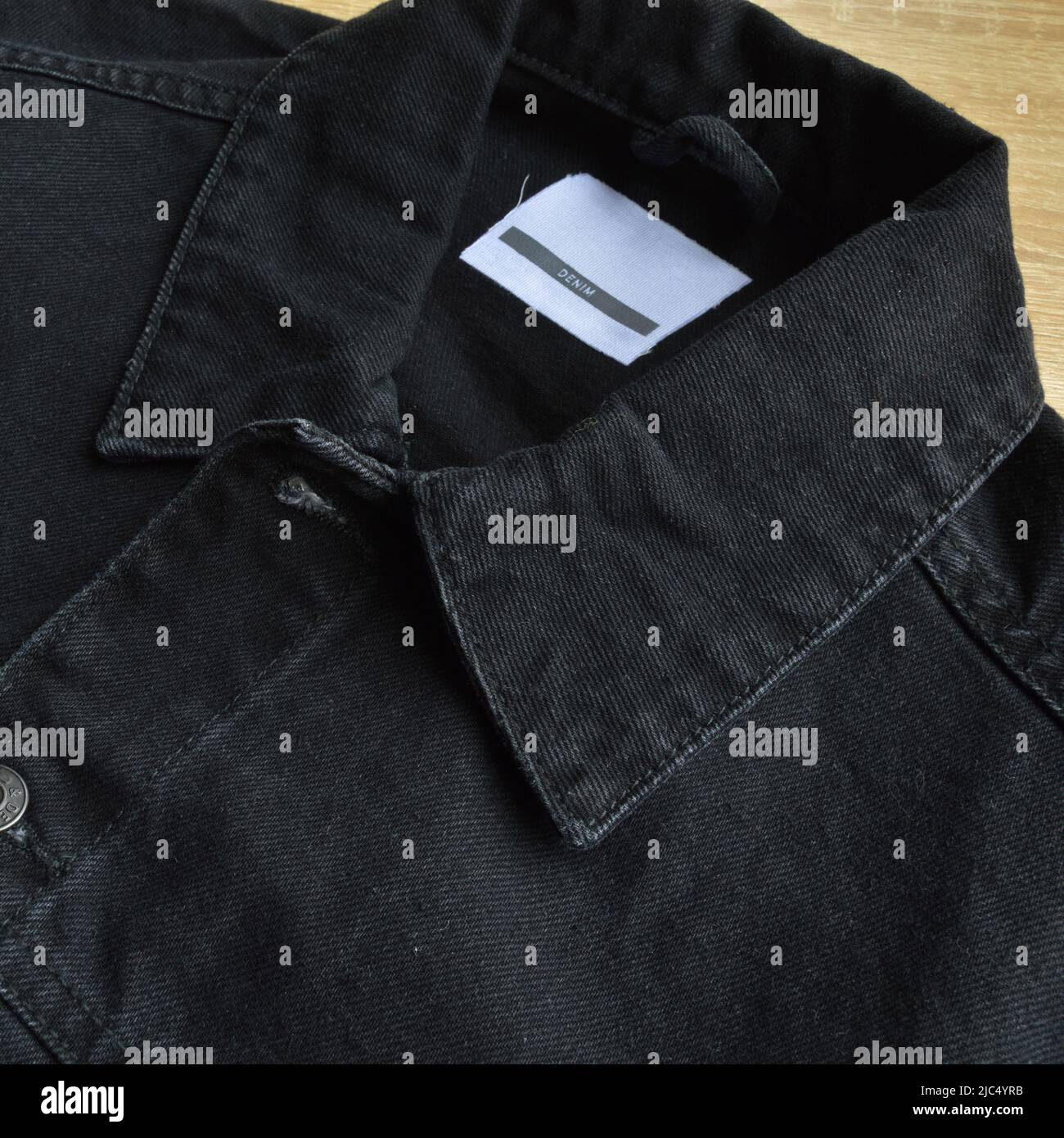 Black jeans denim coat jacket and botton, empty blank sale tag Stock Photo