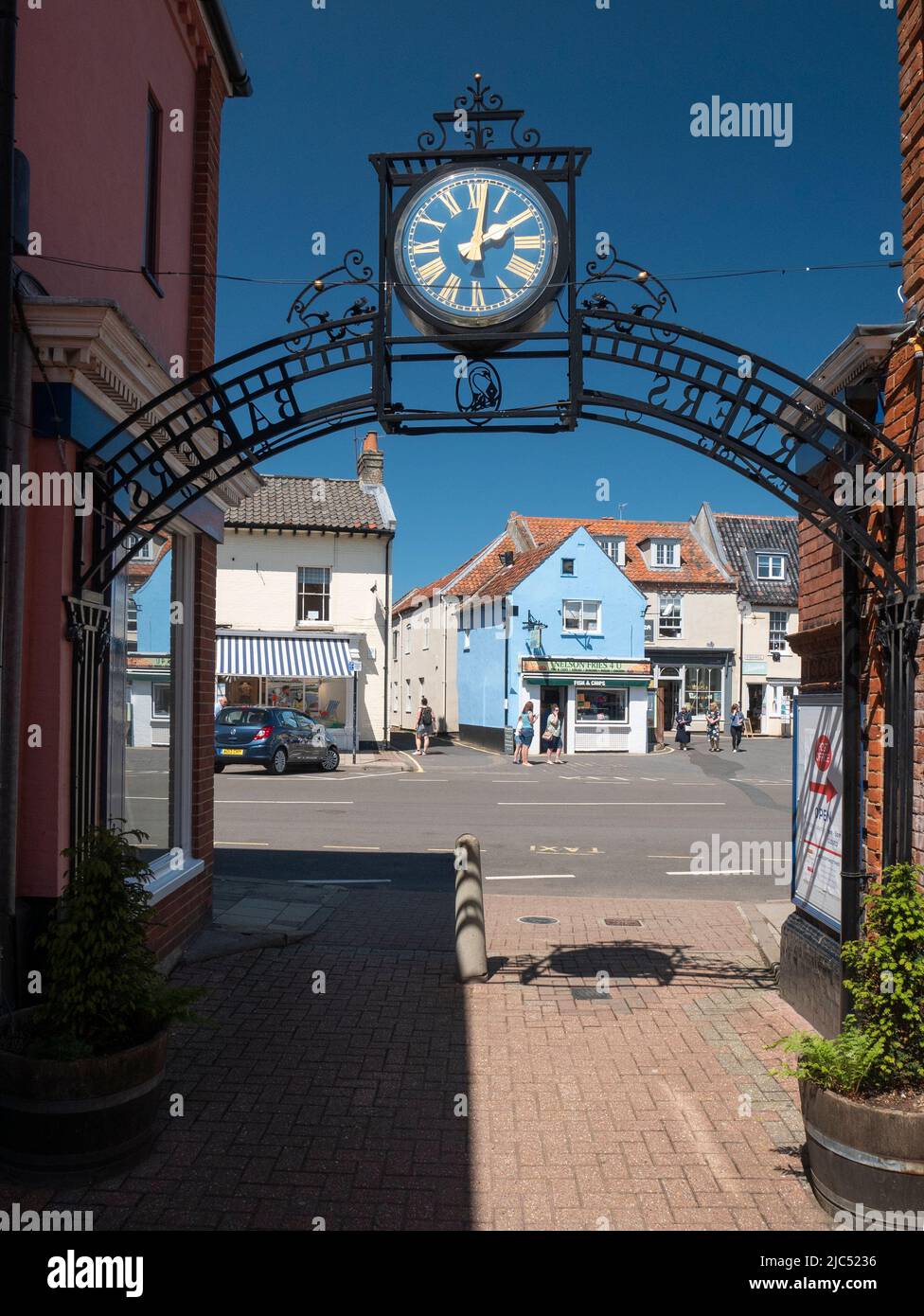 Ornate clock and local shops in Hilt Nofolk Stock Photo