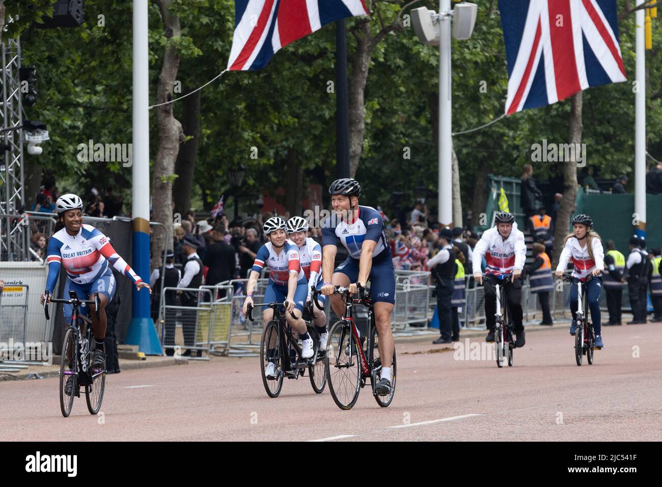 5th June 2022 - Olympians Sir Chris Hoy and Kadeena Cox ride along the Mall in London during Queen Elizabeth's Platinum Jubilee Pageant Stock Photo